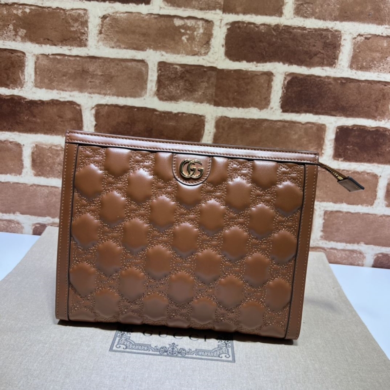 G*u*i clutch bags